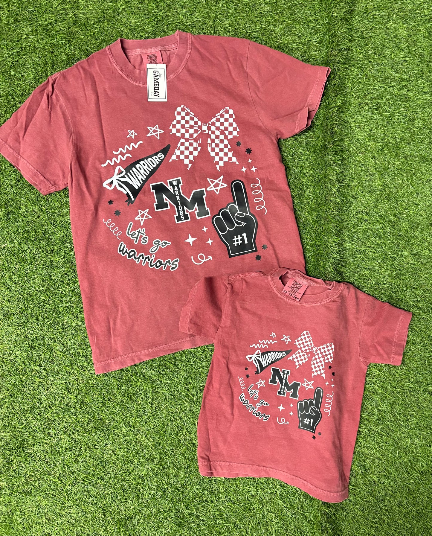 with a bow on top North Miami tee- youth